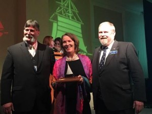 Molly Bolster, Executive Director of the non-profit Gundalow Company, accepts the Sea Education Award at the Tall Ships America national conference in Boston in February.